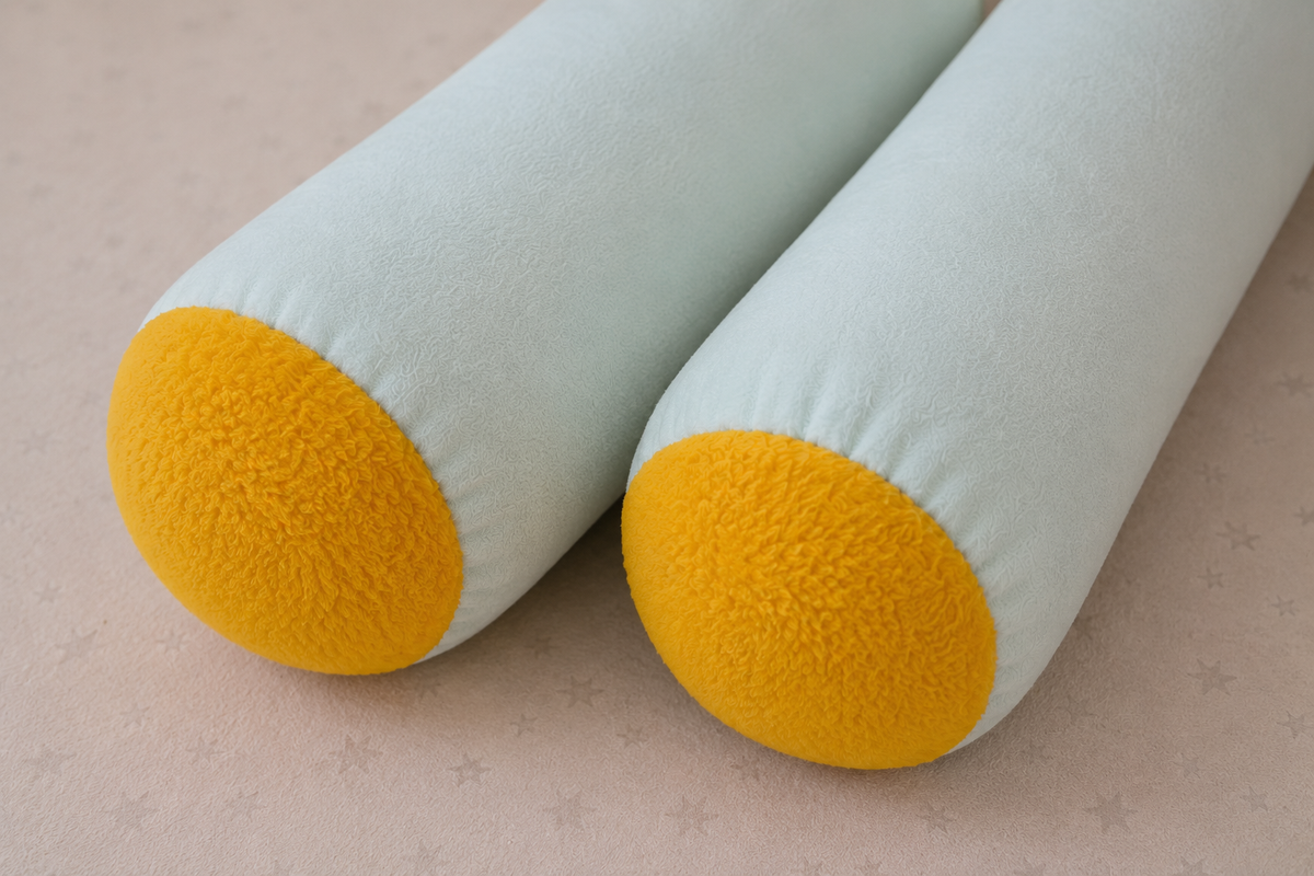Close up of Sunny Mint Baby Bolster yellow textured sherpa end caps showing contrast detail