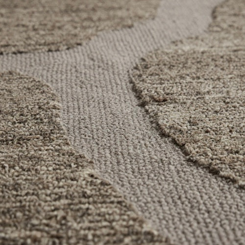 Close-up of Terra Weave Embroidered Rug showing high-low bouclé texture and organic abstract channel outlines
