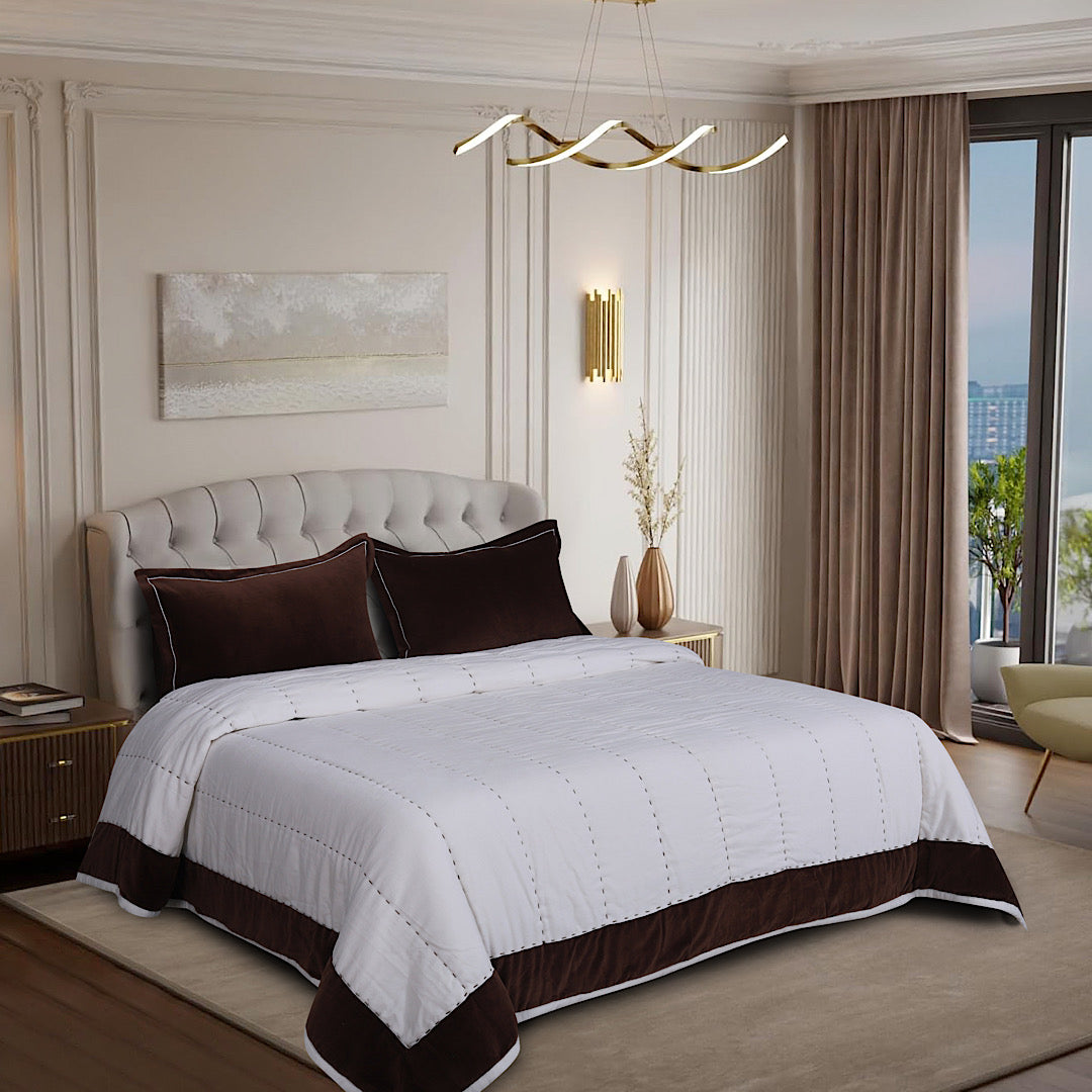 White and chocolate-brown quilt set in an elegant bedroom