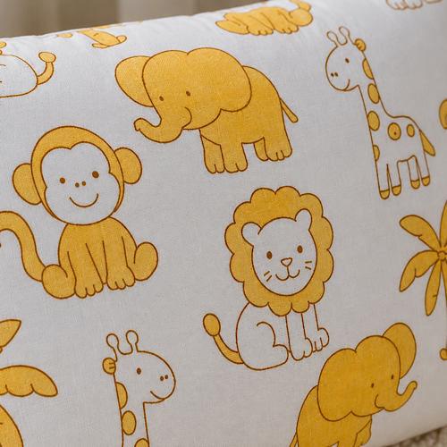Little Safari Baby Pillow close up showing lion elephant giraffe and monkey print